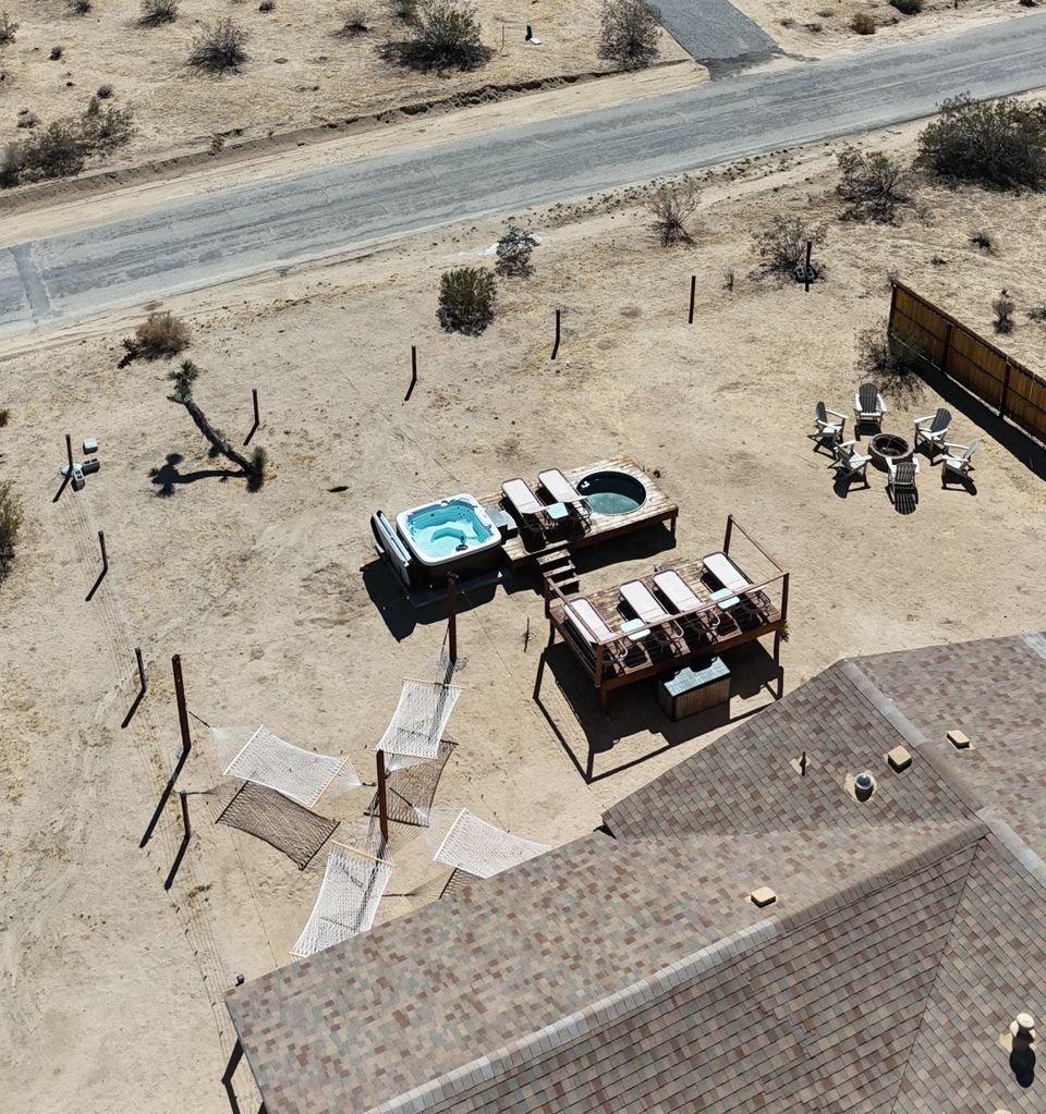 Aerial view of the hot tub, deck and yard