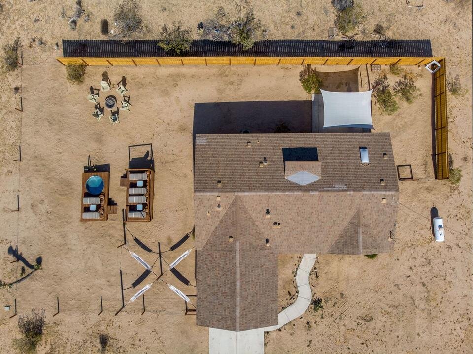 Aerial view of the yard, hot tub and cowboy pool