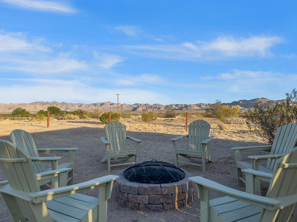Fire pit with chairs and mountain views