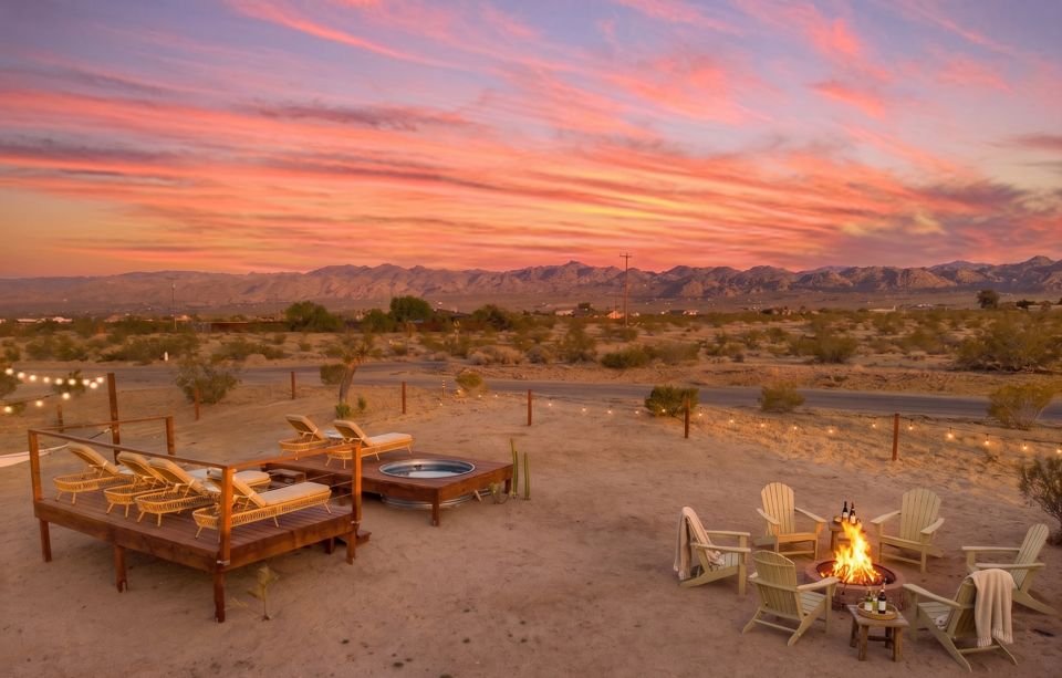 Fire pit and Adirondack chairs at sunset