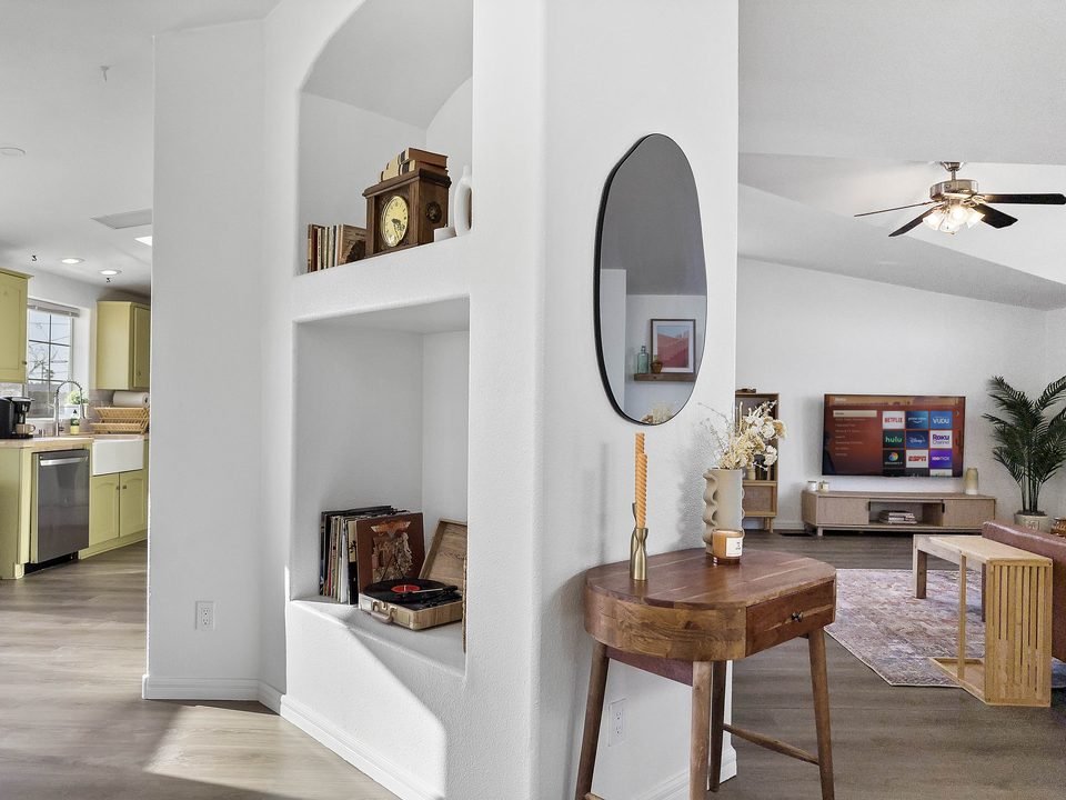 Living room nook with record shelf and view into the kitchen