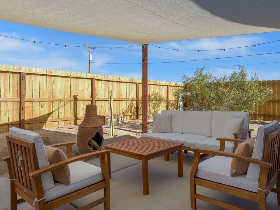 Covered patio with chiminea and lounge seating