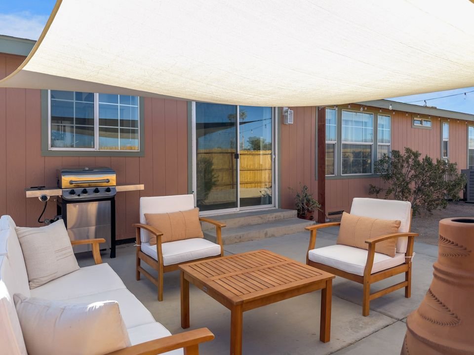 Patio with BBQ grill and outdoor dining